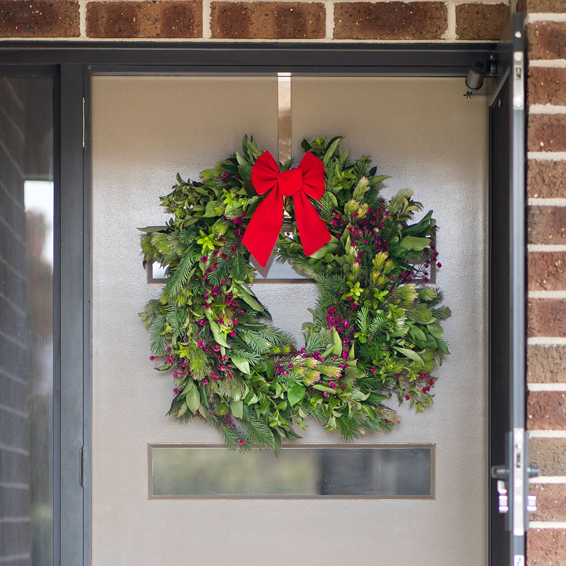 Geelong made Christmas wreath hanging on a door